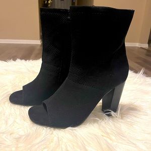 New in box. Torrid Black Knit Stretch Bootie. Size 11.5W.